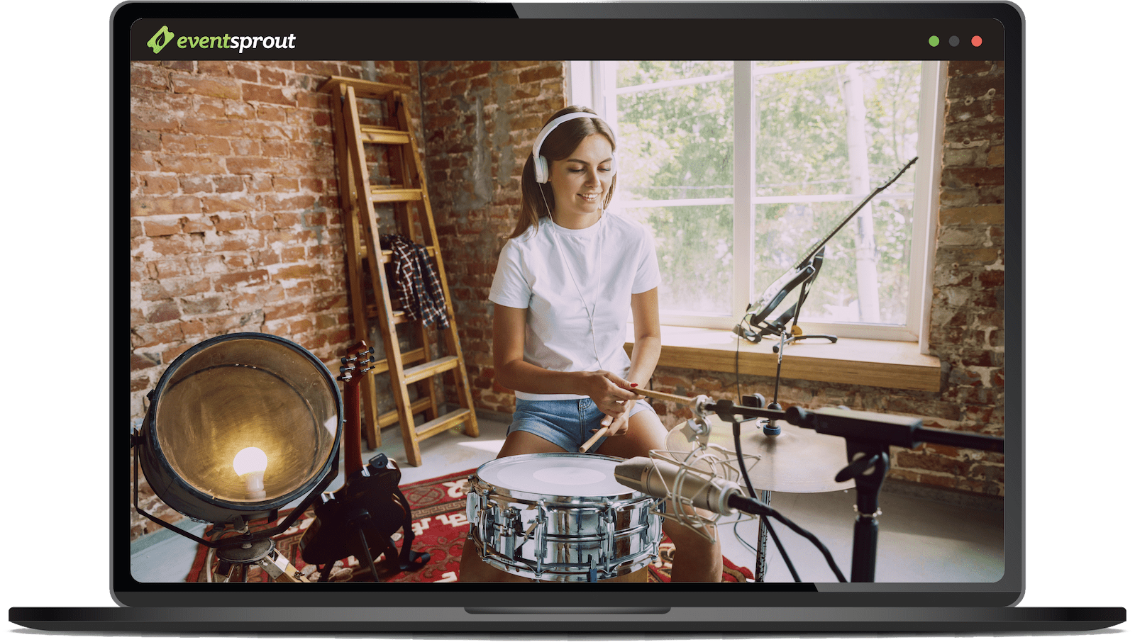 Laptop showing a teenage girl playing the drums on a live zoom event.